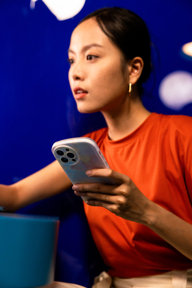 A woman using her phone.