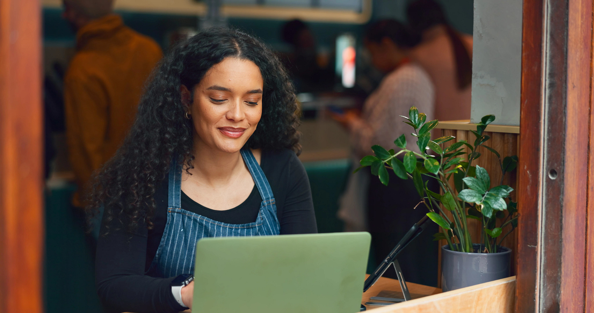 A woman studying on her laptop.