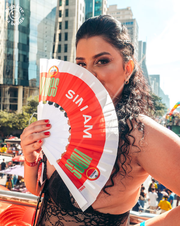 A woman holding a fan
