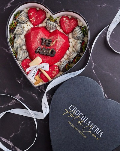 Chocolates in a dark heart shaped box
