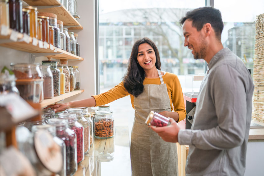 Man and woman looking at jars on a shelf