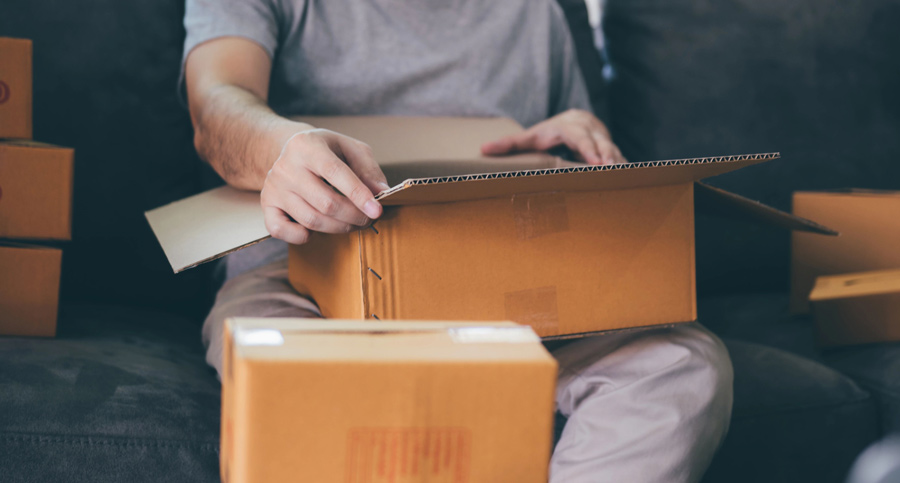 A person opening up a package