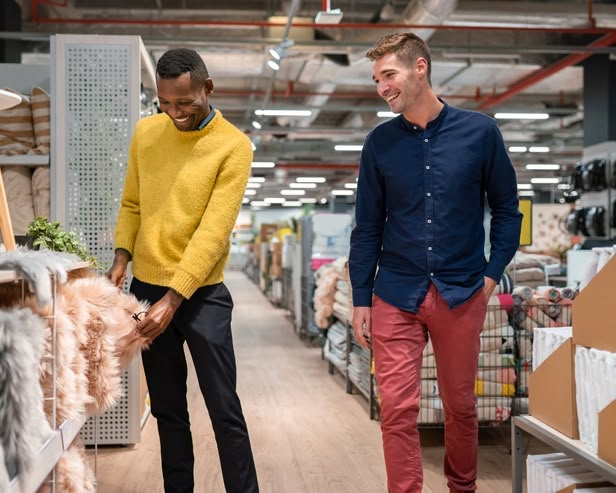 Two men looking at homeware in a store