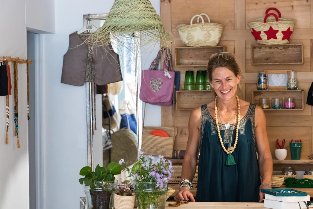 Woman posing for a photo in her store