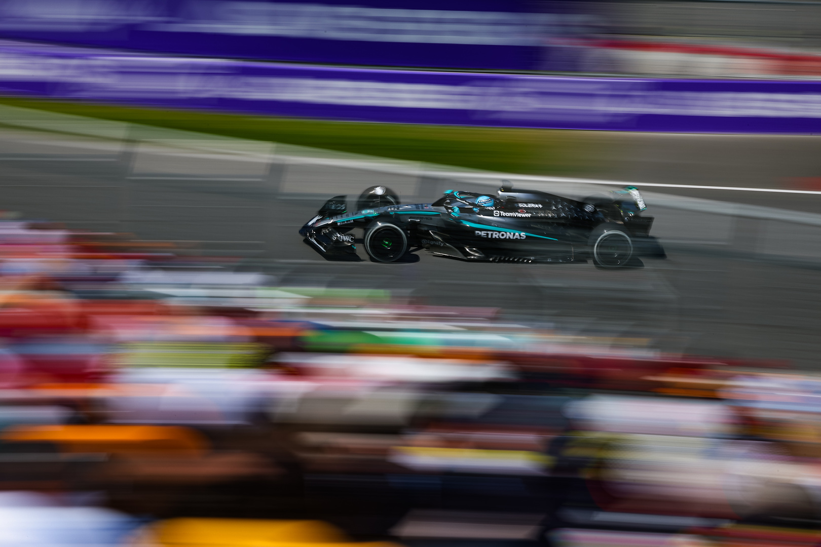 A fast F1 race car in motion.