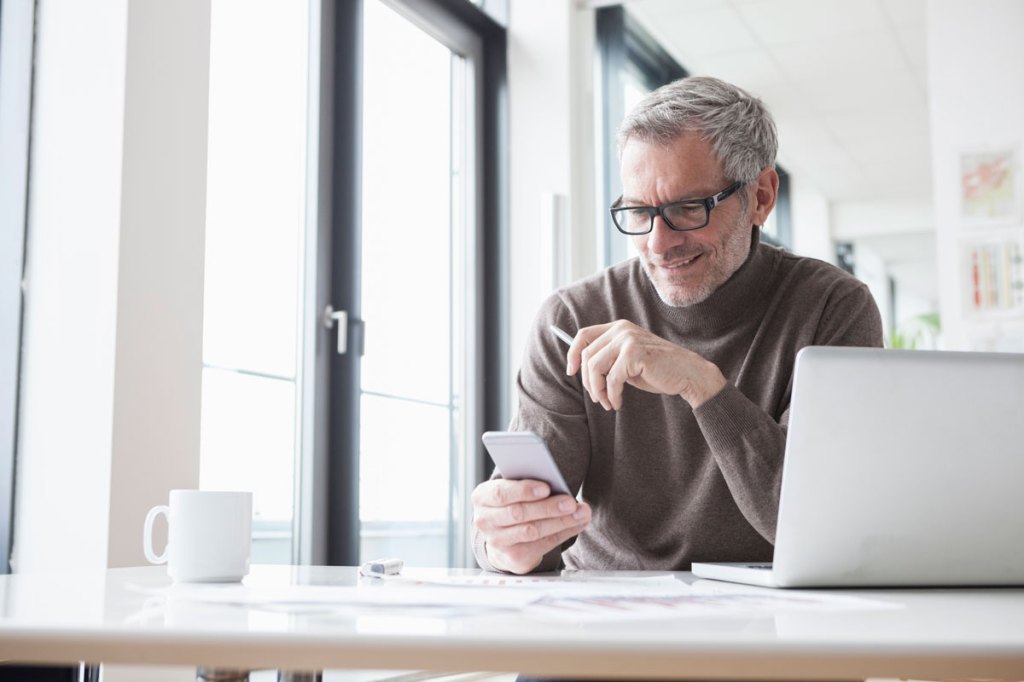 Man on his laptop and phone