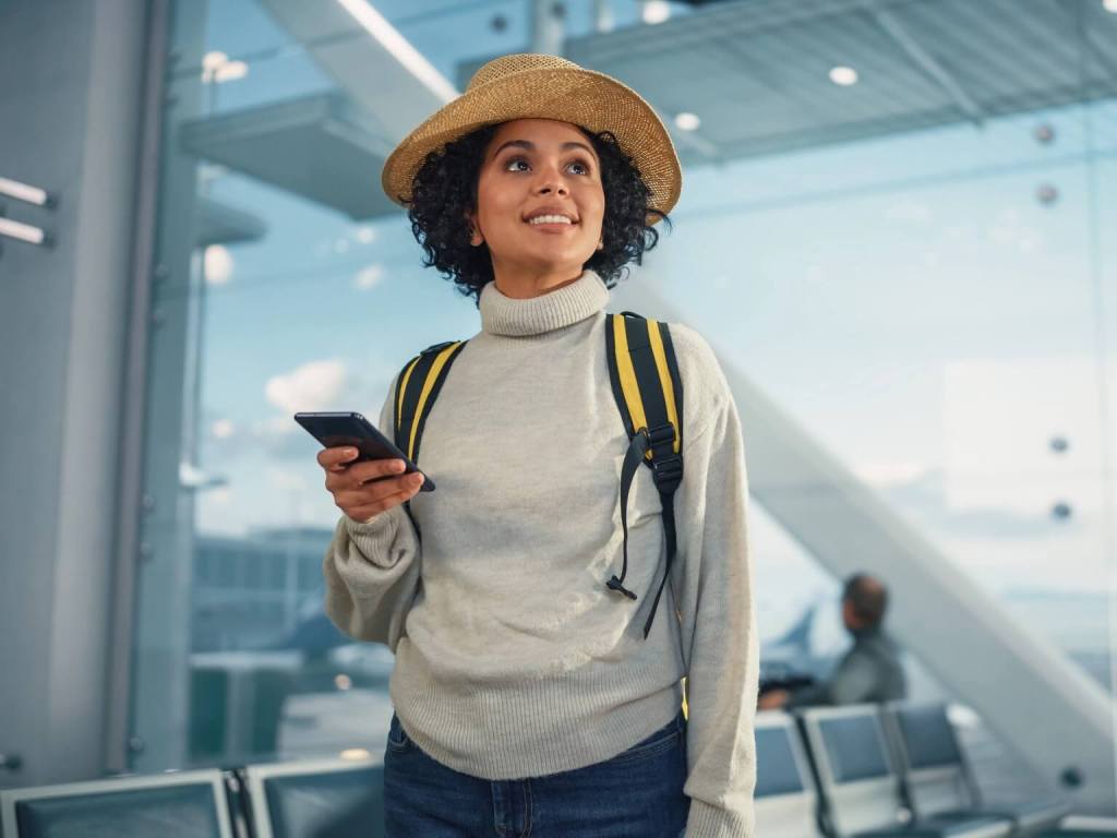 A woman at the airport smiling