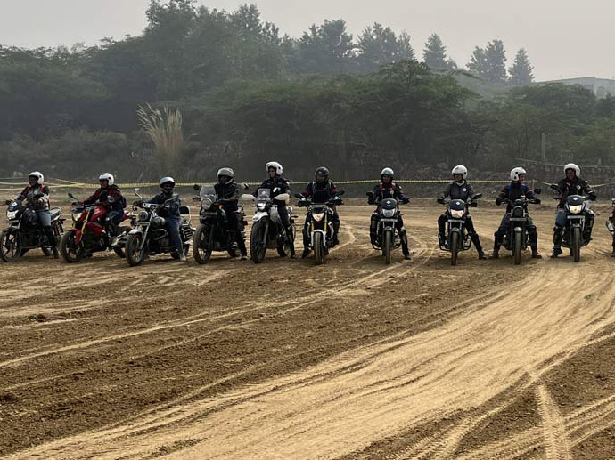 Motorcycle riders lined up on a training course.