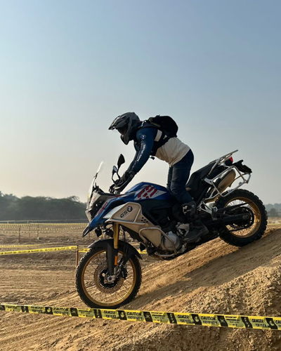 A single motorcycle rider on a course.