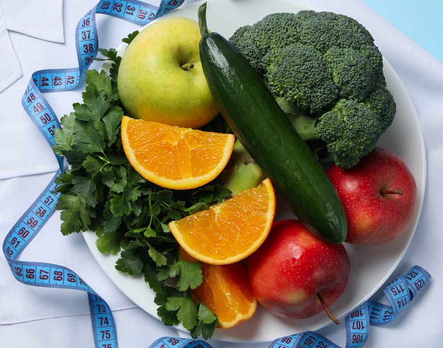 A plate of fruit and vegetables.