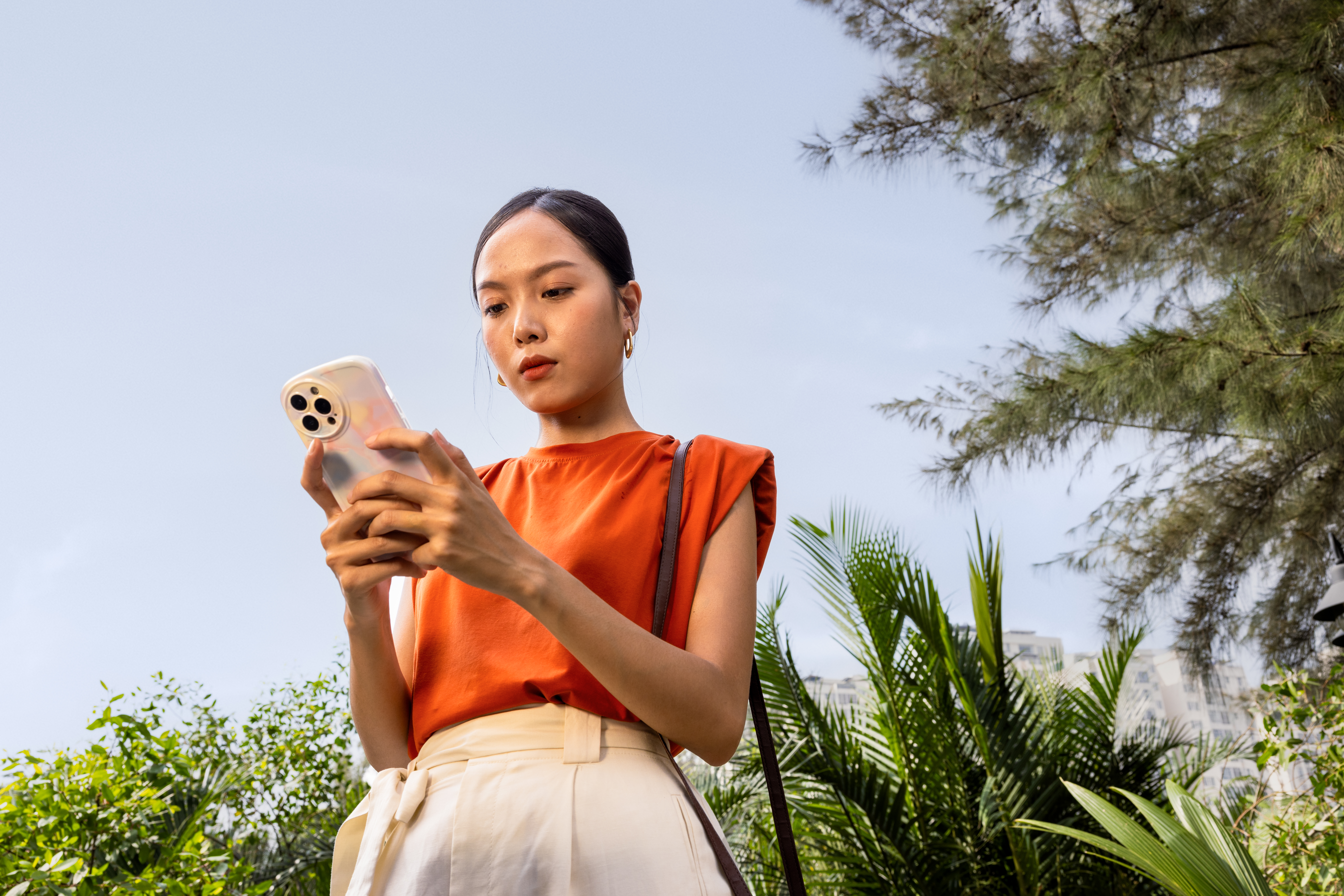 A woman using her phone.