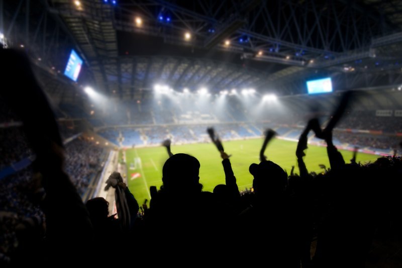A cheering crowd at a football game