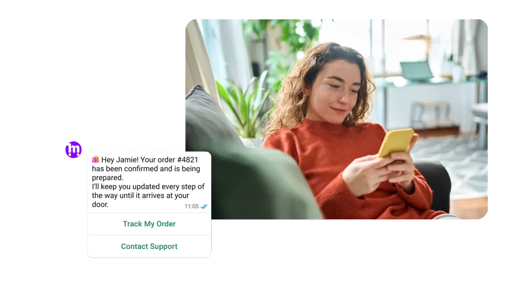 Woman sitting on a couch receiving a message on her phone