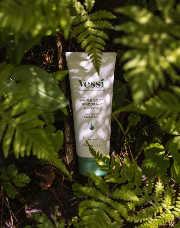 Vessi deodorant tube in a forest setting