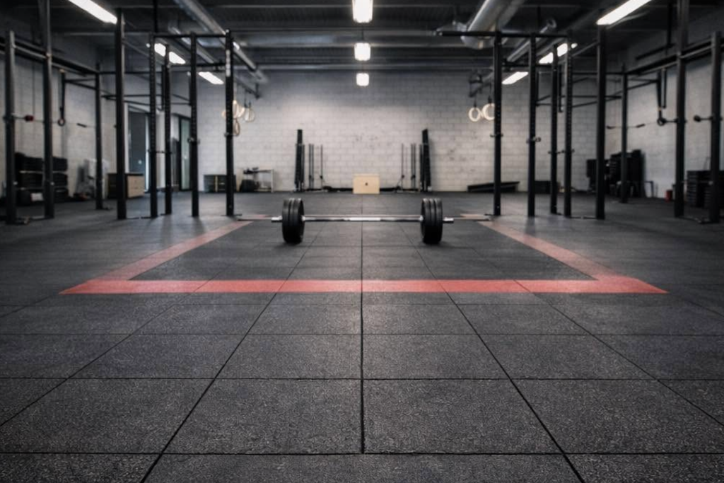 Wide view shot of a gym with GummiTiles and weight lifting equipment