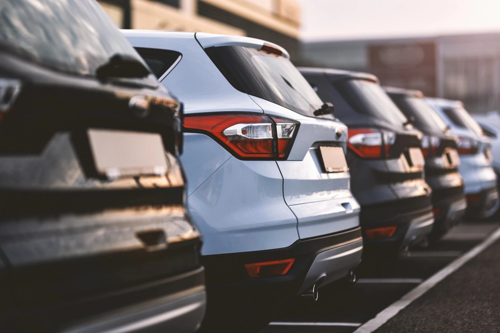 A lineup of rental cars from the rear view