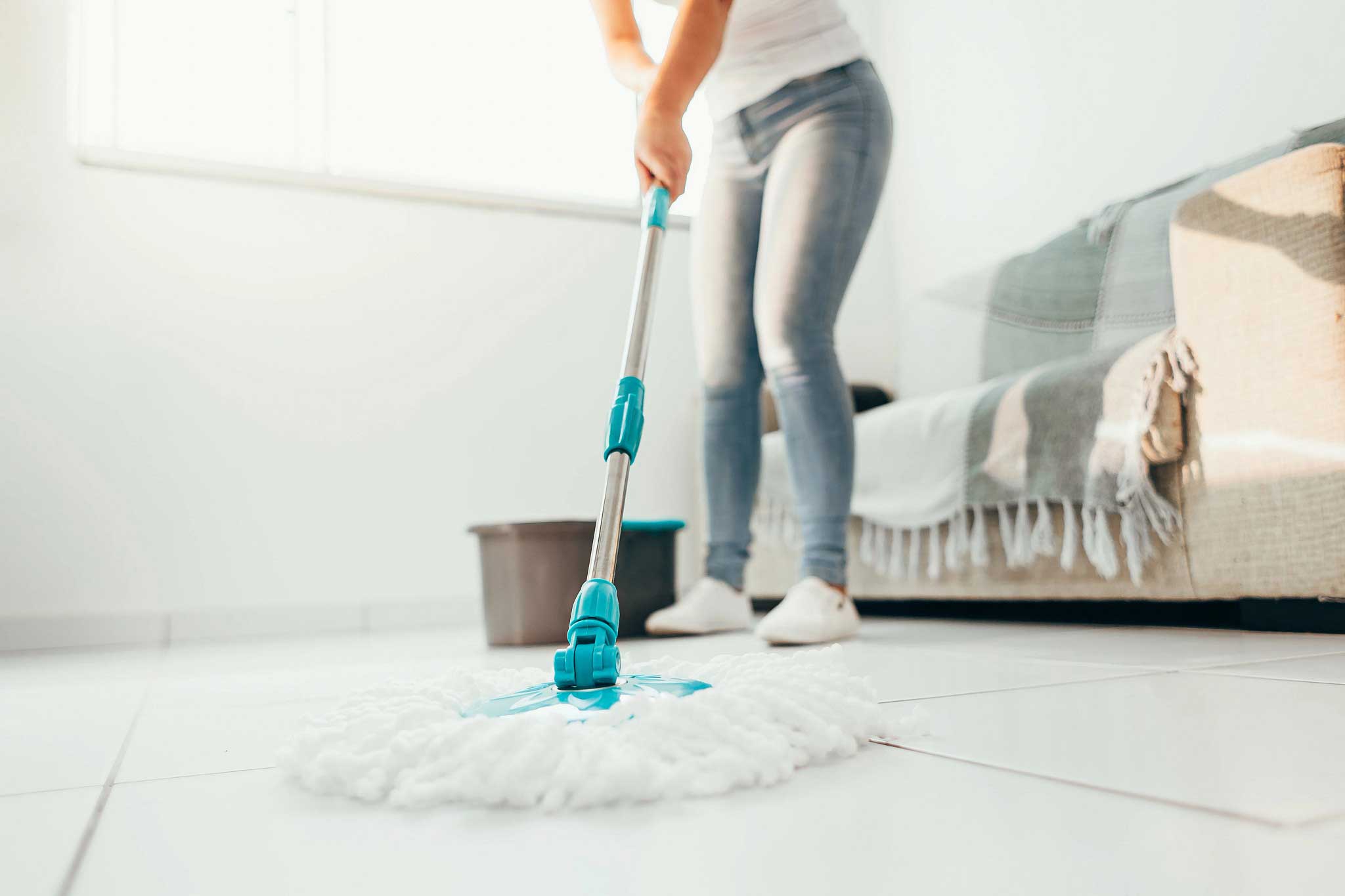 A cleaner mopping the floor