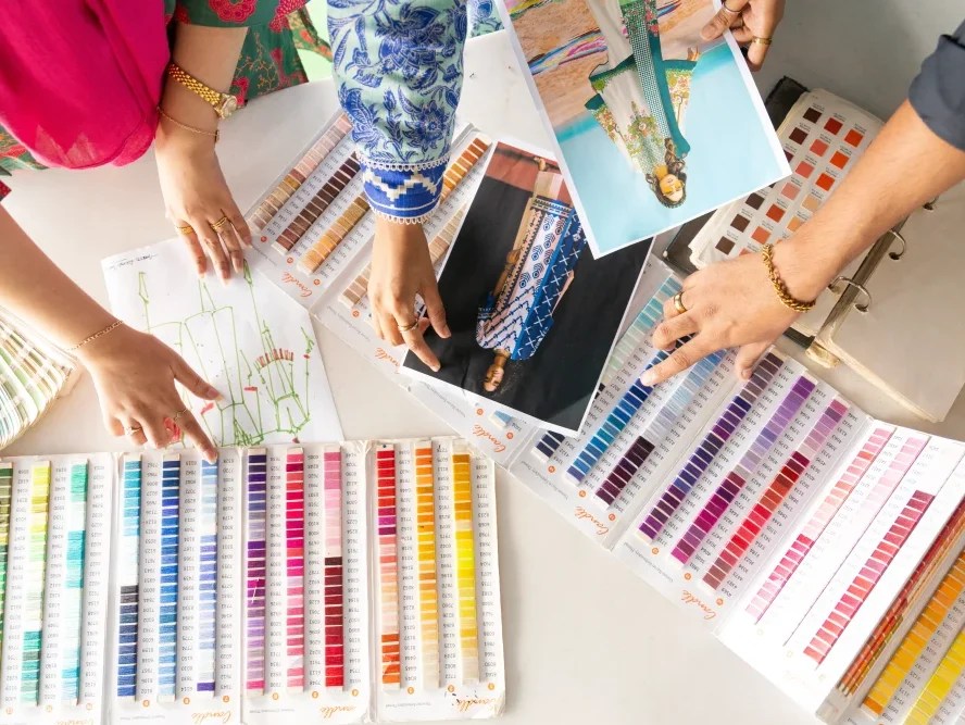 Several people reviewing and selecting color palettes