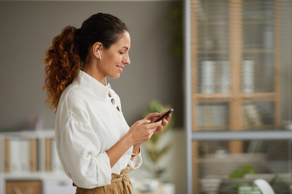 Business owner smiling phone