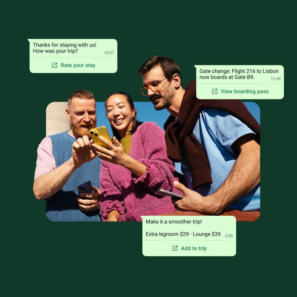 Three people having a discussion while looking at a phone